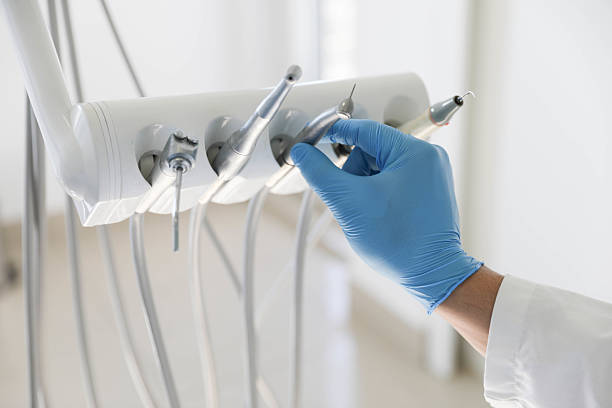 Professional Tooth Extraction technician working in Saline County County, IL